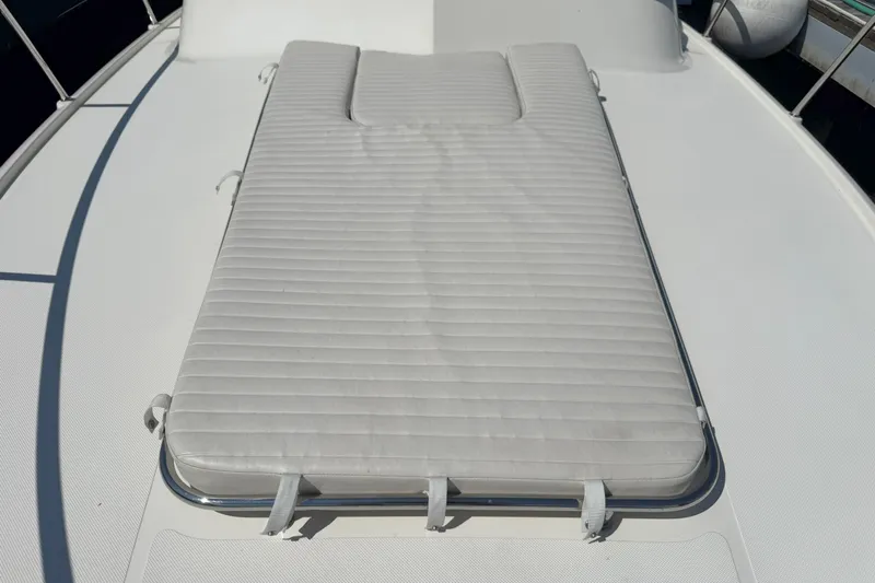  Yacht Photos Pics Sunpad on 2006 Pursuit LS 345 Drummond Runner boat deck, featuring sleek design.