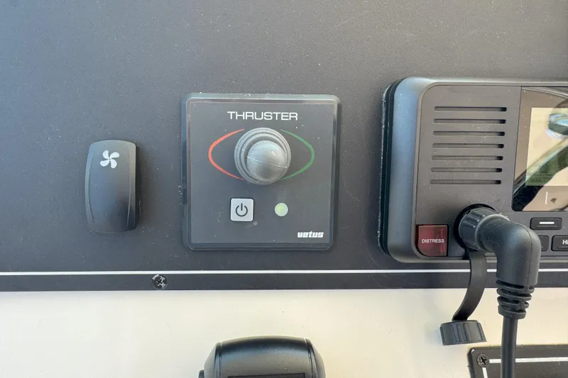  Yacht Photos Pics Control panel of a 2006 Pursuit LS 345 Drummond Runner boat, featuring thruster controls.