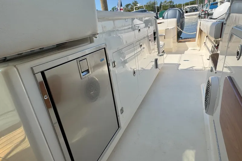  Yacht Photos Pics 2006 Pursuit LS 345 Drummond Runner boat interior with storage compartments and seating.