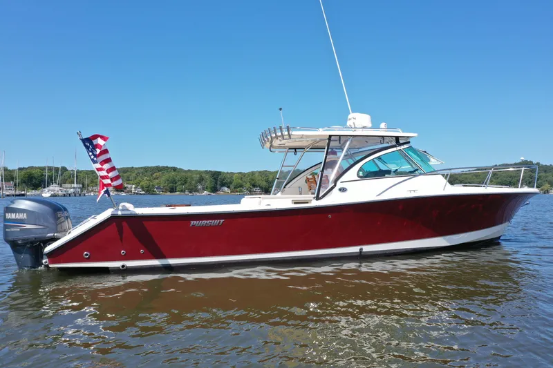  Yacht Photos Pics 2006 Pursuit LS 345 Drummond Runner boat on water, American flag, Yamaha engine.