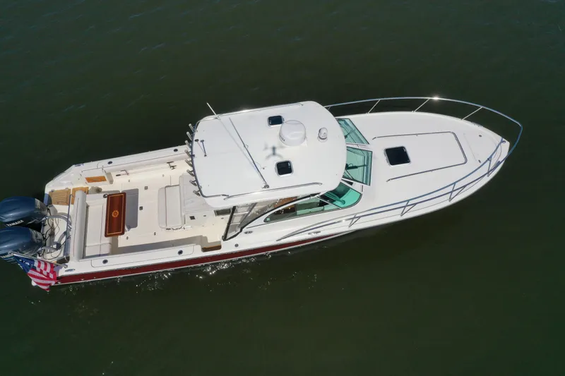 Yacht Photos Pics Aerial view of 2006 Pursuit LS 345 Drummond Runner boat on water.