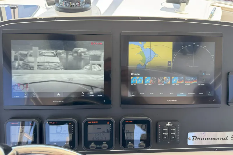  Yacht Photos Pics Boat dashboard with Garmin navigation screens on a 2006 Pursuit LS 345 Drummond Runner.