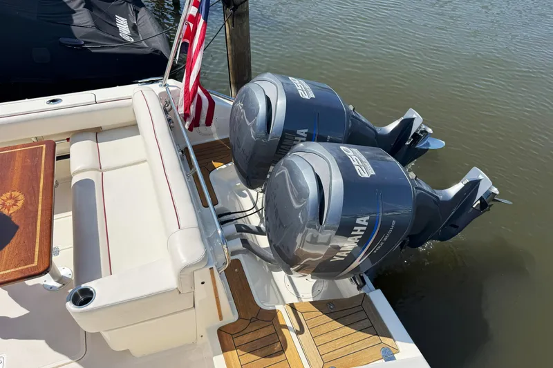  Yacht Photos Pics 2006 Pursuit LS 345 Drummond Runner with twin Yamaha 250 engines, docked by water.