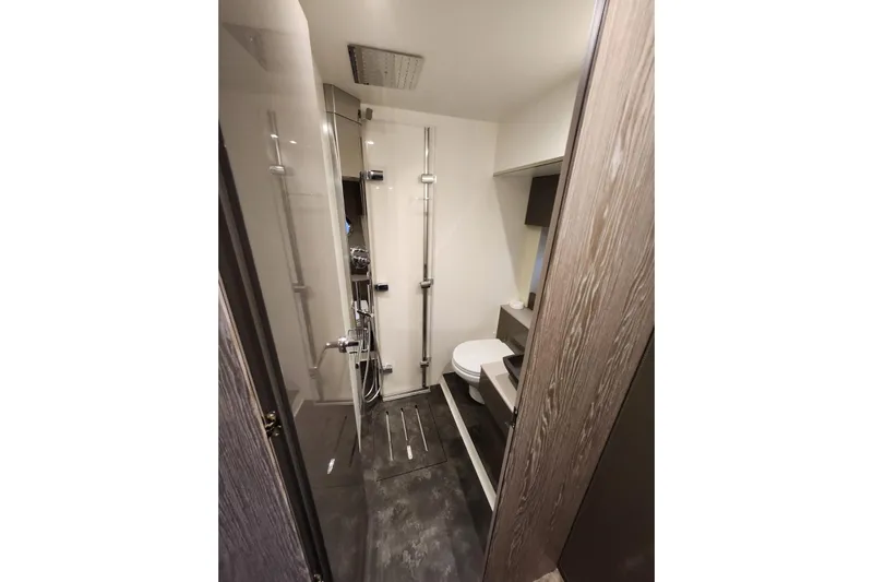  Yacht Photos Pics Modern bathroom interior in 2023 Cranchi M44 HT yacht, featuring sleek design and fixtures.