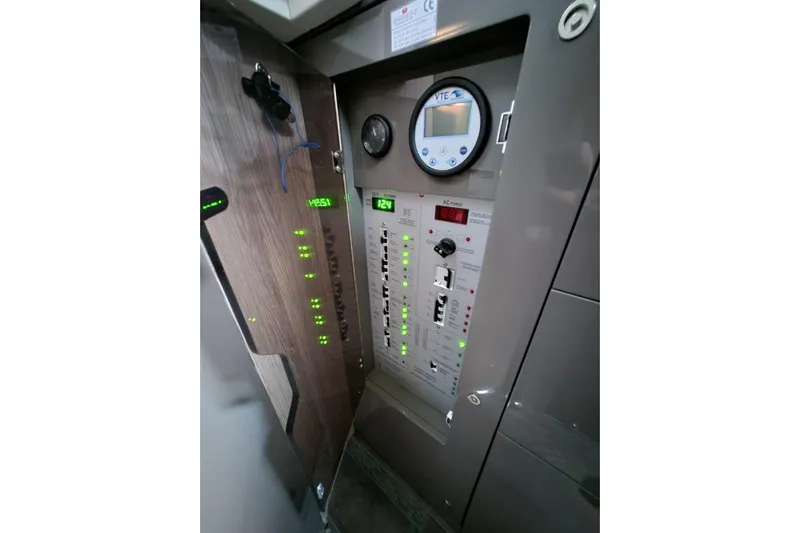  Yacht Photos Pics Electrical control panel of 2023 Cranchi M44 HT yacht, featuring digital displays and switches.