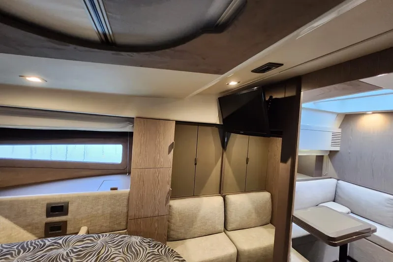  Yacht Photos Pics Luxurious interior of 2023 Cranchi M44 HT yacht with modern furnishings and cozy seating.