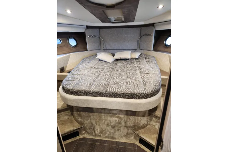  Yacht Photos Pics Luxurious cabin interior of 2023 Cranchi M44 HT yacht with elegant bedding.