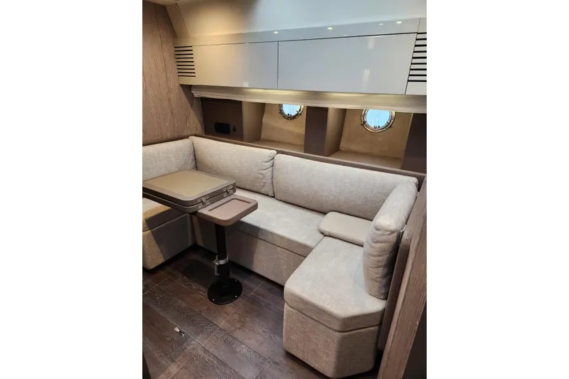  Yacht Photos Pics Luxurious interior of 2023 Cranchi M44 HT yacht with elegant seating and modern design.