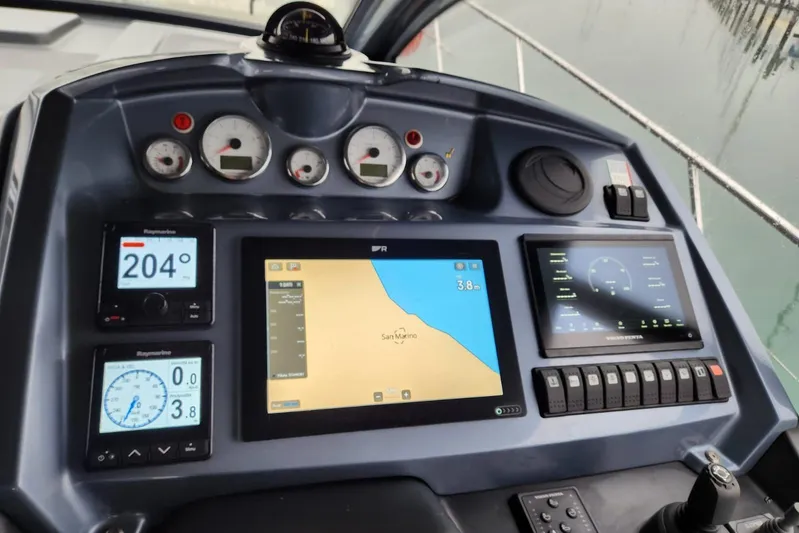  Yacht Photos Pics Control panel of 2023 Cranchi M44 HT yacht with navigation and monitoring displays.