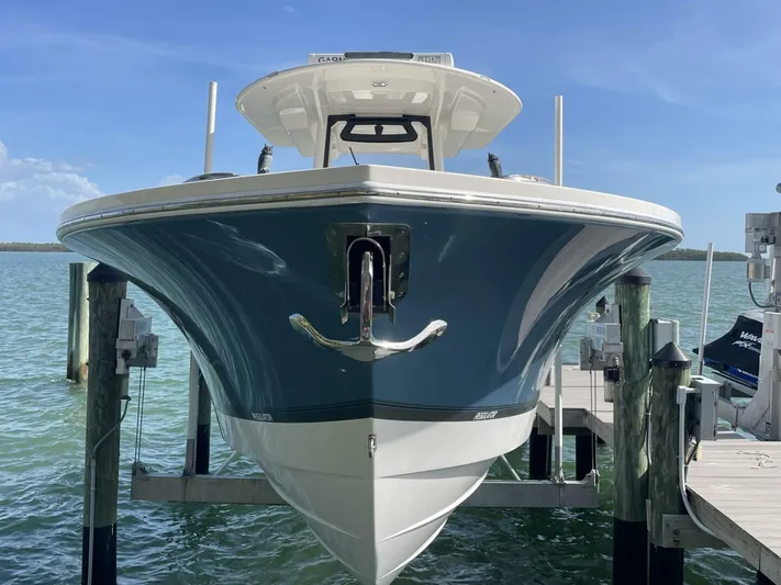  Yacht Photos Pics 2023 Regulator 31 boat docked on a sunny day, front view.