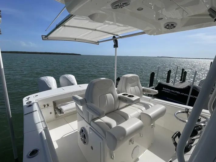  Yacht Photos Pics 2023 Regulator 31 boat interior with dual seats and ocean view.