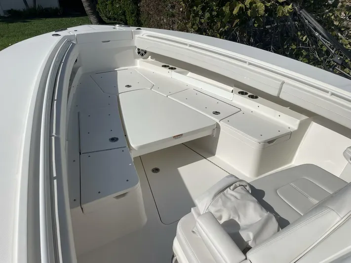  Yacht Photos Pics 2023 Regulator 31 boat interior with spacious seating and storage compartments.