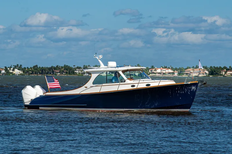 King's Landing Yacht Photos Pics 2024 Hinckley 35 boat cruising on a sunny day with American flag.