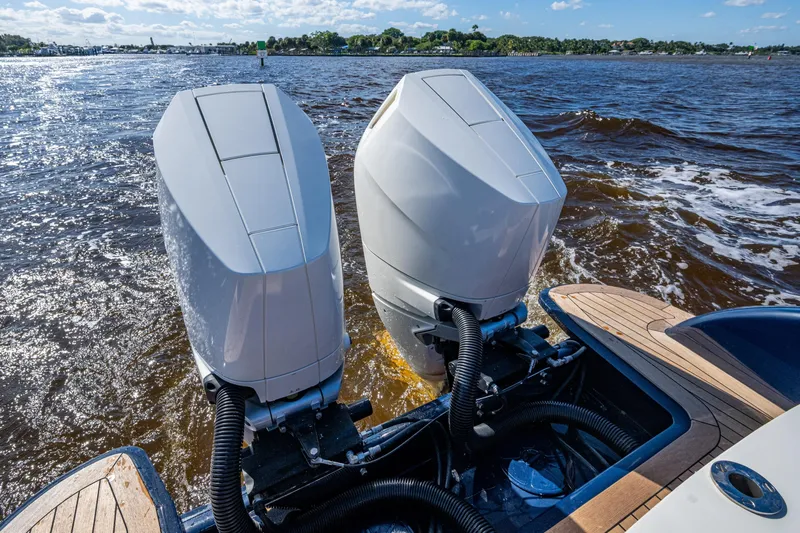 King's Landing Yacht Photos Pics 2024 Hinckley 35 boat with dual outboard motors on a sunny day.
