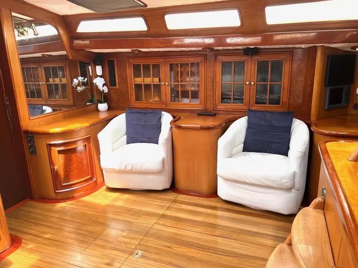 Wind Seeker 1 Yacht Photos Pics Luxurious 1989 Windship 60 yacht interior with elegant wood finish and plush seating.