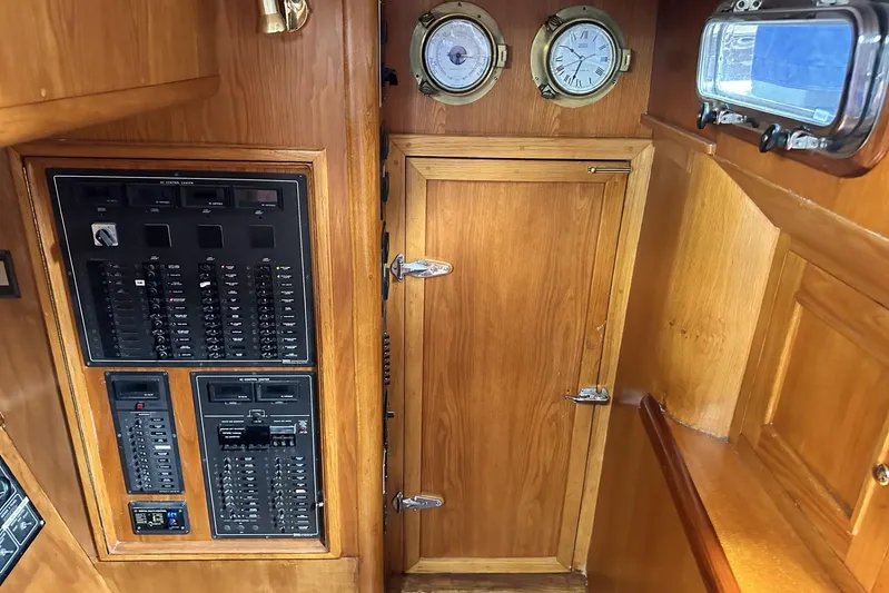 Wind Seeker 1 Yacht Photos Pics Interior of 1989 Windship 60 yacht with control panels and wooden cabinetry.