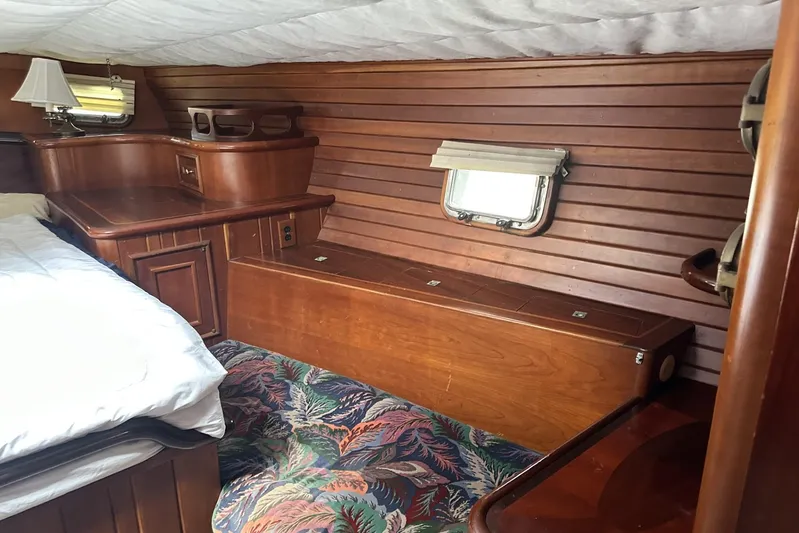 Wind Seeker 1 Yacht Photos Pics Cozy 1989 Windship 60 yacht cabin with wooden interior and floral carpet.