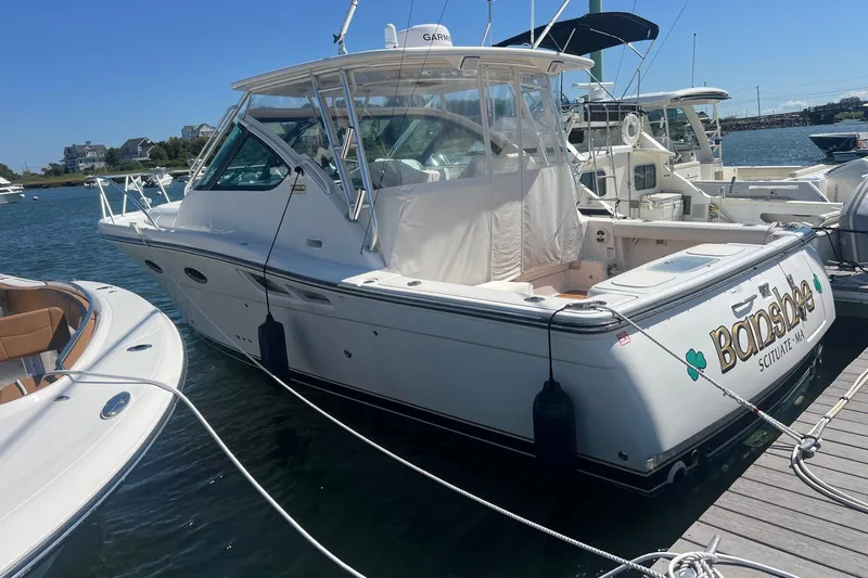  Yacht Photos Pics 2008 Tiara Yachts 3200 Open docked at marina, sunny day, side view.