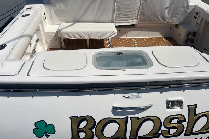  Yacht Photos Pics 2008 Tiara Yachts 3200 Open cockpit with seating and storage compartments.