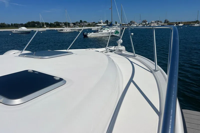  Yacht Photos Pics 2008 Tiara Yachts 3200 Open on calm water, showcasing sleek deck and railing design.