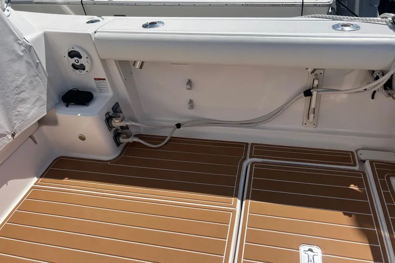  Yacht Photos Pics 2008 Tiara Yachts 3200 Open deck with teak flooring and fishing rod holders.