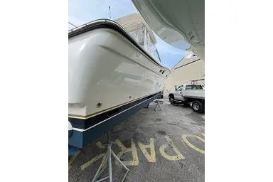  Yacht Photos Pics 2008 Tiara Yachts 3200 Open boat on stands in a parking area.