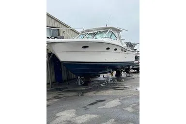  Yacht Photos Pics 2008 Tiara Yachts 3200 Open on stands, white hull, blue bottom, dockside view.