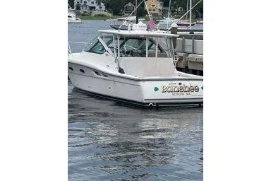  Yacht Photos Pics 2008 Tiara Yachts 3200 Open docked in a marina, side view.