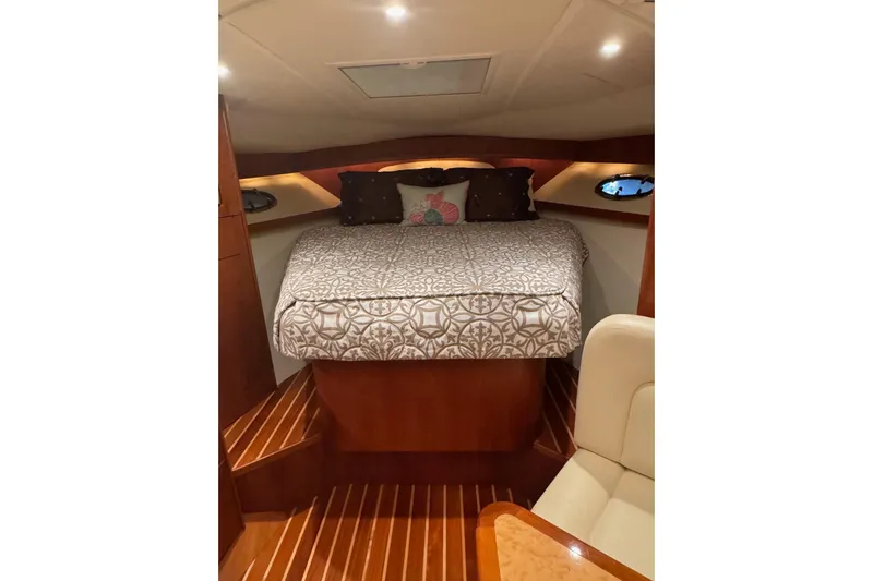  Yacht Photos Pics Luxurious cabin interior of 2008 Tiara Yachts 3200 Open with elegant bedding.