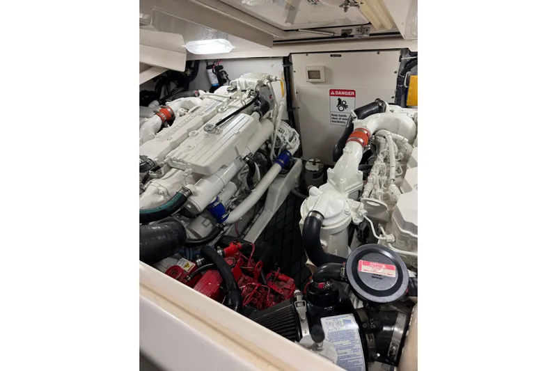  Yacht Photos Pics Engine room of 2008 Tiara Yachts 3200 Open, showcasing dual engines and mechanical components.