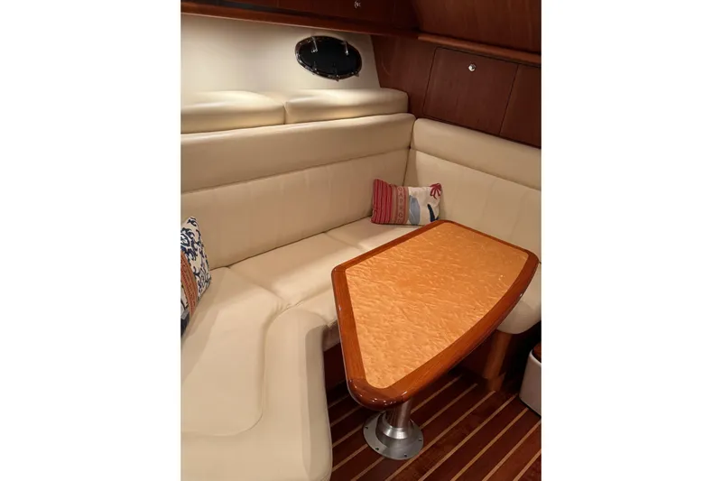  Yacht Photos Pics Luxurious interior of 2008 Tiara Yachts 3200 Open with elegant seating and table.