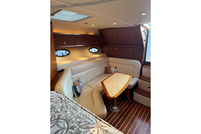 Yacht Photos Pics Luxurious interior of 2008 Tiara Yachts 3200 Open with elegant seating and wooden accents.