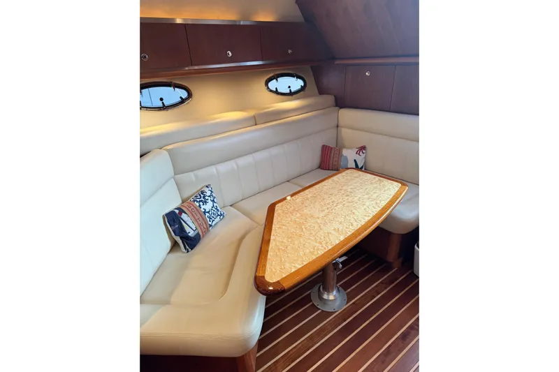  Yacht Photos Pics 2008 Tiara Yachts 3200 Open interior with elegant seating and wooden table.