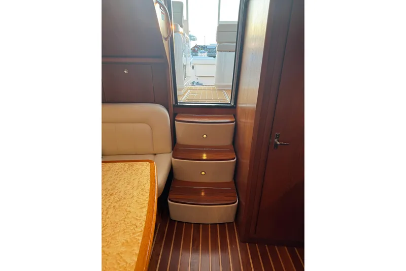  Yacht Photos Pics Interior of 2008 Tiara Yachts 3200 Open, featuring wooden steps and cabin details.