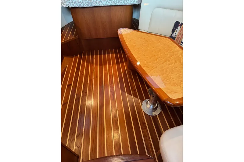  Yacht Photos Pics 2008 Tiara Yachts 3200 Open interior with polished wood flooring and table.