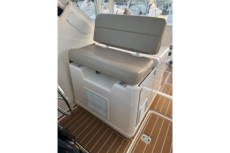  Yacht Photos Pics 2008 Tiara Yachts 3200 Open helm seat with beige cushion and white base.