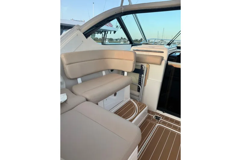  Yacht Photos Pics 2008 Tiara Yachts 3200 Open interior with beige seating and wooden flooring.