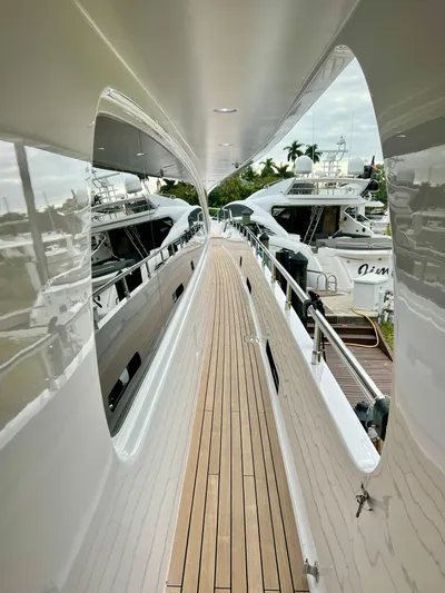 Panacea Yacht Photos Pics Side deck view of 2011 Mengi Yay 115 MY yacht in marina.