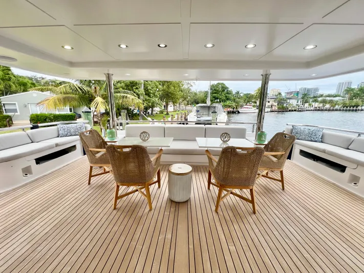 Panacea Yacht Photos Pics Luxurious deck of 2011 Mengi Yay 115 MY yacht with elegant seating and scenic view.