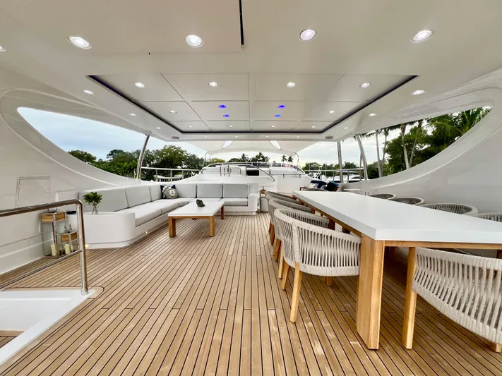 Panacea Yacht Photos Pics Luxurious 2011 Mengi Yay 115 MY yacht deck with elegant seating and dining area.