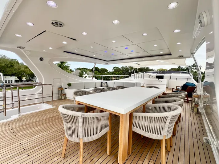 Panacea Yacht Photos Pics Luxurious 2011 Mengi Yay 115 MY yacht deck with elegant dining area.