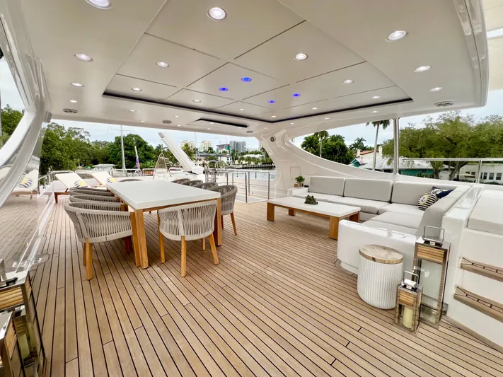 Panacea Yacht Photos Pics Luxurious 2011 Mengi Yay 115 MY yacht deck with elegant seating and dining area.