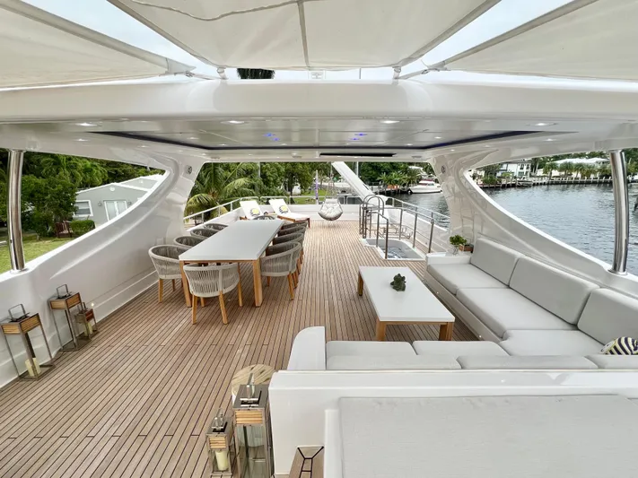 Panacea Yacht Photos Pics Luxurious 2011 Mengi Yay 115 MY yacht deck with elegant seating and dining area.