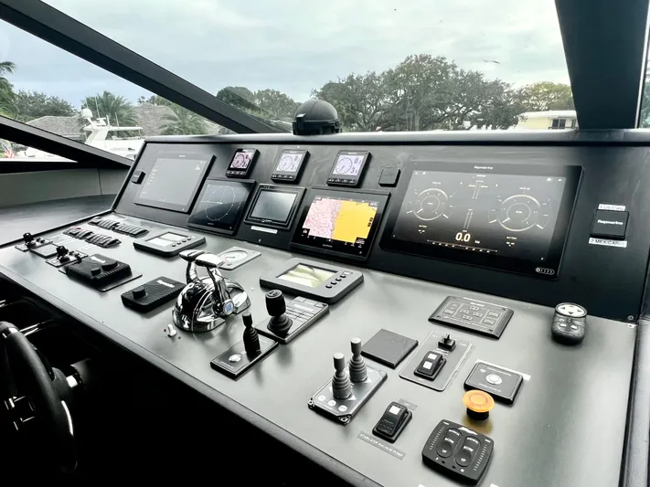 Panacea Yacht Photos Pics Control panel of 2011 Mengi Yay 115 MY yacht with navigation screens and controls.