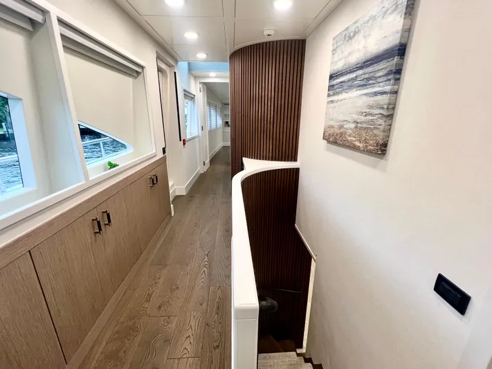 Panacea Yacht Photos Pics Luxurious interior hallway of 2011 Mengi Yay 115 MY yacht with modern decor.