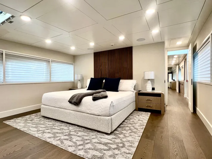 Panacea Yacht Photos Pics Luxurious bedroom interior on 2011 Mengi Yay 115 MY yacht, featuring modern design and cozy ambiance.