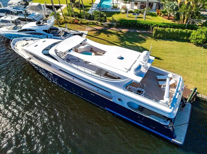 Panacea Yacht Photos Pics Luxurious 2011 Mengi Yay 115 MY yacht docked by lush waterfront.