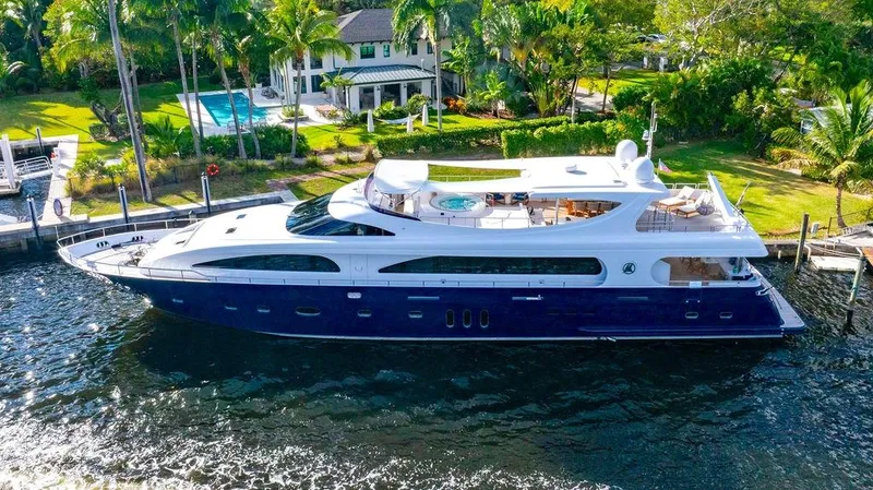 Panacea Yacht Photos Pics Luxurious 2011 Mengi Yay 115 MY yacht docked by a waterfront property.