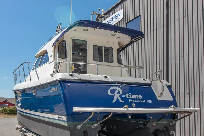 R Time Yacht Photos Pics 2013 Aspen C90 boat "R-time" in Stanwood, WA, docked near a building.