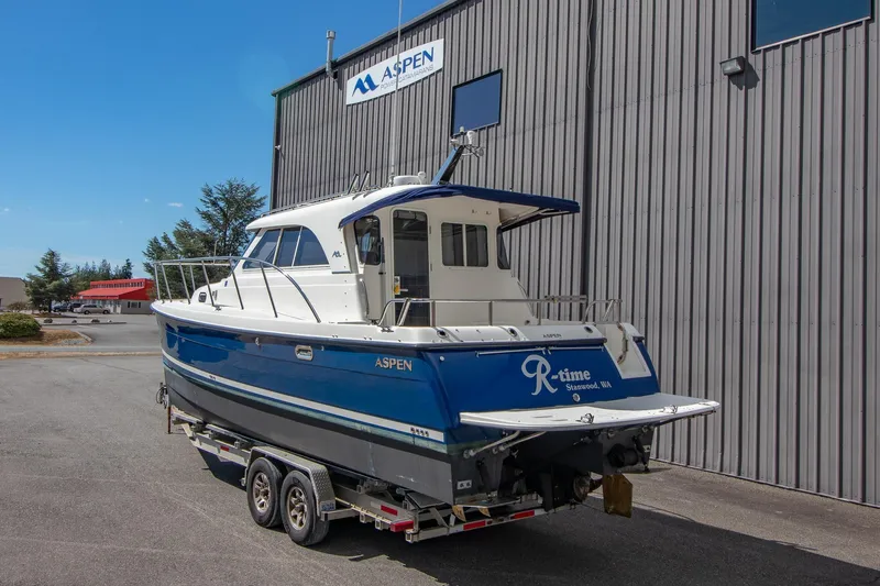 R Time Yacht Photos Pics 2013 Aspen C90 boat on trailer outside a building, Stanwood, WA.
